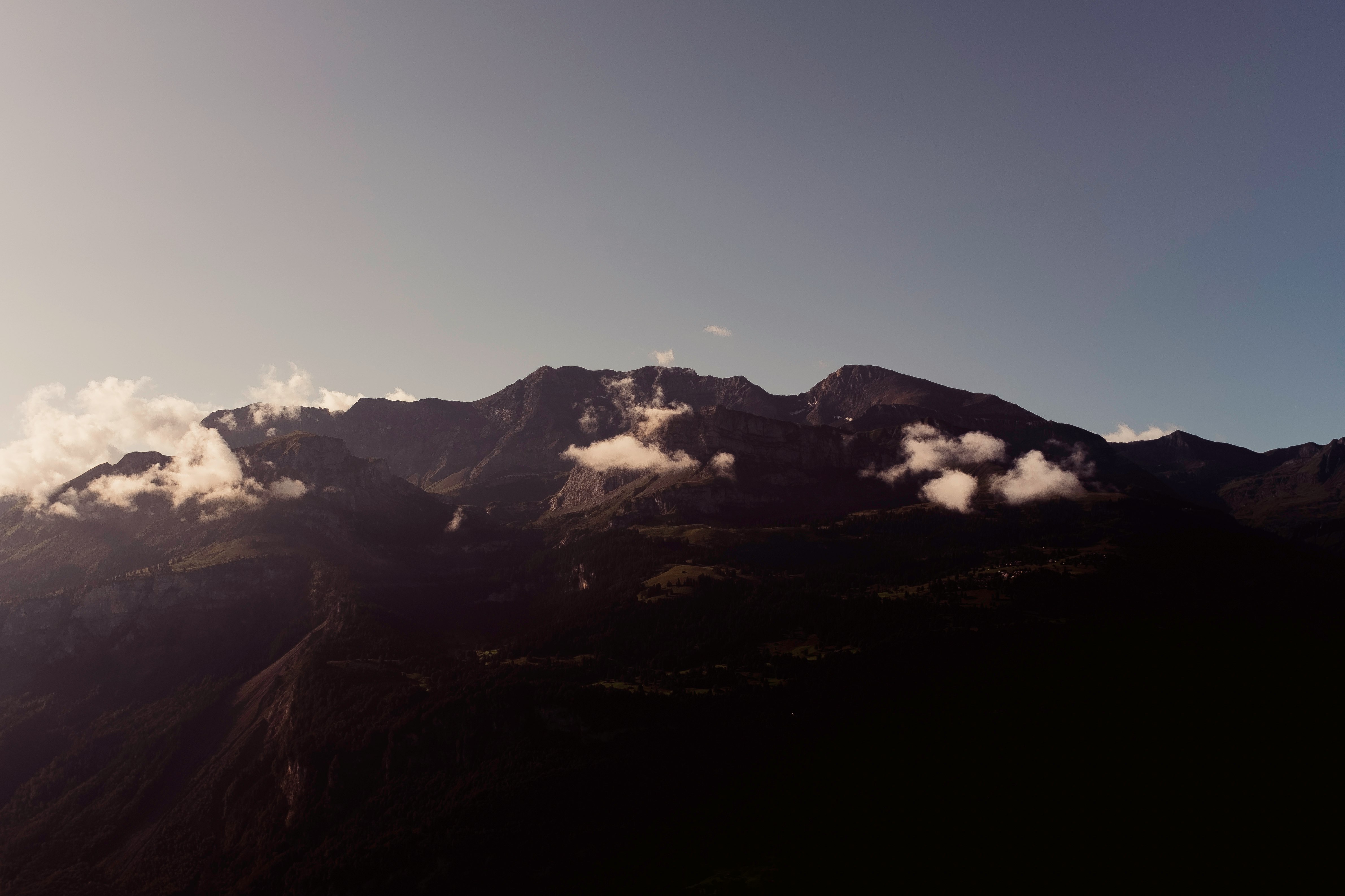 snow covered mountain during daytime